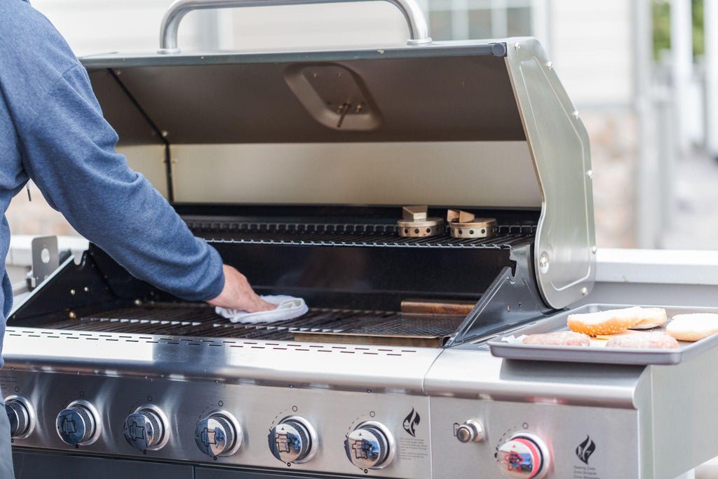 Cleaning the barbecue grill grate. 